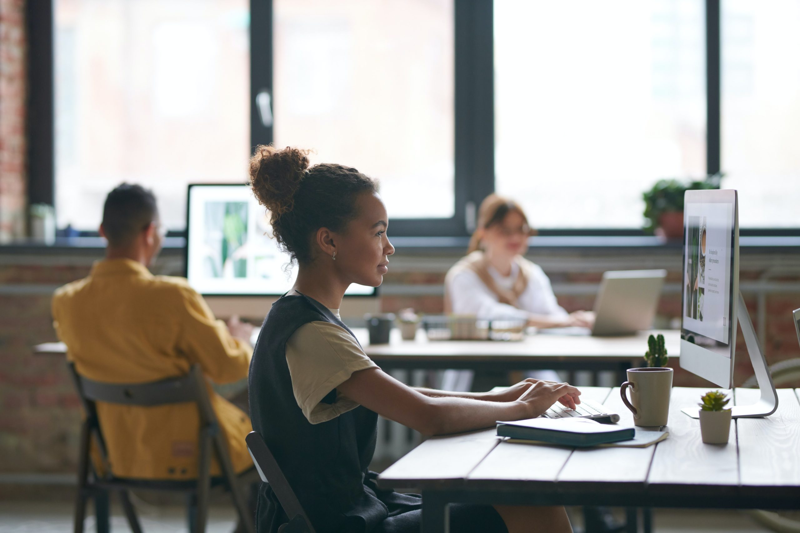 Woman typing in Small Nashville SEO Agency